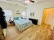 Spacious main bedroom featuring a tray ceiling, windows, and wood flooring at 24 Samuel Nw Way, Cartersville, GA 30121