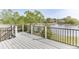 Outdoor deck featuring black metal railings with views of the lake and surrounding landscape at 3390 Mill Valley Dr, Dacula, GA 30019