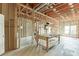 Unfinished basement area with wood framing, concrete floor, and windows for natural light at 3390 Mill Valley Dr, Dacula, GA 30019