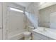 Bathroom featuring a shower/tub combo, a white toilet and a sink with a mirror at 3390 Mill Valley Dr, Dacula, GA 30019