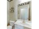 Traditional-style bathroom with white floral wallpaper, white sink, and vanity at 3390 Mill Valley Dr, Dacula, GA 30019
