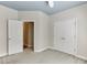 Empty bedroom featuring an open door and a double-door closet at 3390 Mill Valley Dr, Dacula, GA 30019