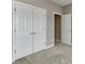Bright bedroom featuring a double door closet with gold hardware and neutral gray walls at 3390 Mill Valley Dr, Dacula, GA 30019