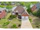 Charming brick home with a well-maintained front lawn, mature landscaping, and attached two-car garage at 3390 Mill Valley Dr, Dacula, GA 30019