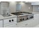 Stainless steel stovetop and deep fryer are integrated into the kitchen countertop at 3390 Mill Valley Dr, Dacula, GA 30019