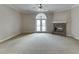 Spacious living room featuring a stone fireplace and a ceiling fan at 3390 Mill Valley Dr, Dacula, GA 30019