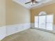 Living room with wainscotting and large window at 3390 Mill Valley Dr, Dacula, GA 30019