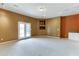 Open-concept living room with carpeted floors, and neutral color walls at 3390 Mill Valley Dr, Dacula, GA 30019
