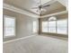 Large main bedroom featuring a tray ceiling and multiple windows at 3390 Mill Valley Dr, Dacula, GA 30019