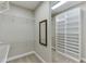 Walk-in closet with built-in shelving and a mirror at 3390 Mill Valley Dr, Dacula, GA 30019