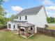 Expansive backyard with a covered patio featuring comfortable seating, ideal for outdoor relaxation at 461 Timberleaf Rd, Canton, GA 30115