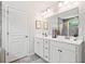 Bathroom featuring double vanity, sleek cabinets, and modern fixtures in a serene space at 461 Timberleaf Rd, Canton, GA 30115