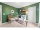 Cozy Bedroom features gold crib, glider, and charming decor, creating a comforting space at 461 Timberleaf Rd, Canton, GA 30115