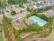 Aerial view of neighborhood pool featuring lounge chairs and green landscaping at 461 Timberleaf Rd, Canton, GA 30115