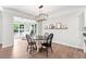 Charming dining area with natural light, modern light fixture and decorative wall shelf at 461 Timberleaf Rd, Canton, GA 30115