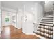 Spacious foyer with hardwood floors, staircase, and ample natural light at 461 Timberleaf Rd, Canton, GA 30115