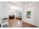 Bright living room with hardwood floors, a piano, and a comfortable seating area at 461 Timberleaf Rd, Canton, GA 30115