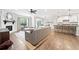 Spacious open-concept living room featuring a fireplace and connection to a modern kitchen at 461 Timberleaf Rd, Canton, GA 30115