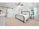 Spacious main bedroom with tray ceilings, ceiling fan, barn door, and neutral tones at 461 Timberleaf Rd, Canton, GA 30115