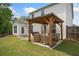 Outdoor patio featuring a wood pergola and lounge furniture for relaxing and grilling at 461 Timberleaf Rd, Canton, GA 30115