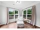 Sun room with hardwood floors, a comfortable chair, and natural light at 461 Timberleaf Rd, Canton, GA 30115