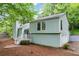 Charming home with light-colored exterior, with a staircase, and green yard at 495 Ramsdale Dr, Roswell, GA 30075