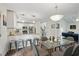 Modern kitchen and dining area with a view into the adjacent living room, all with hardwood floors at 495 Ramsdale Dr, Roswell, GA 30075