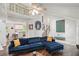 Bright living room with vaulted ceilings and hardwood floors showcasing the staircase and open kitchen at 495 Ramsdale Dr, Roswell, GA 30075