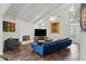 Bright living room featuring vaulted ceilings, a modern fireplace, and comfortable blue seating at 495 Ramsdale Dr, Roswell, GA 30075