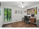 Home office with hardwood floors, natural light, and modern desk at 495 Ramsdale Dr, Roswell, GA 30075