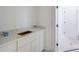 Bathroom featuring light countertops and white cabinets at 51 Deer Canyon Dr, Auburn, GA 30011