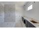 Elegant bathroom featuring modern fixtures, sleek marble accents, and vanity at 51 Deer Canyon Dr, Auburn, GA 30011