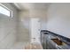 Bathroom featuring marbled tile in the shower and a modern vanity at 51 Deer Canyon Dr, Auburn, GA 30011