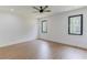Spacious bedroom featuring hardwood floors, two large windows, and a ceiling fan at 51 Deer Canyon Dr, Auburn, GA 30011