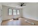 Bedroom with a ceiling fan and multiple windows showing the view at 51 Deer Canyon Dr, Auburn, GA 30011