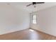 This bedroom features sleek wood floors, a contemporary ceiling fan, and a modern window at 51 Deer Canyon Dr, Auburn, GA 30011