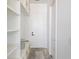 Hallway with built-in shelving offering practical storage solutions near the doorway at 51 Deer Canyon Dr, Auburn, GA 30011