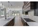 Contemporary kitchen featuring a long island, gas range, and modern pendant lighting at 51 Deer Canyon Dr, Auburn, GA 30011