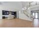Open-concept kitchen with an island, dark cabinets, and a staircase leading to the second floor at 51 Deer Canyon Dr, Auburn, GA 30011