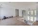 Bright living room with large windows and a unique chandelier at 51 Deer Canyon Dr, Auburn, GA 30011