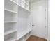 Well-organized mudroom with built-in shelving, bench seating, and storage cubbies, perfect for entry at 51 Deer Canyon Dr, Auburn, GA 30011