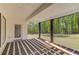 Covered patio with wood framework and view of the backyard at 51 Deer Canyon Dr, Auburn, GA 30011