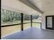 Covered patio with cable railing, dark wood pillars, and an exterior door at 51 Deer Canyon Dr, Auburn, GA 30011