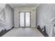 Spacious unfinished room featuring modern doors, light walls, and a concrete floor at 51 Deer Canyon Dr, Auburn, GA 30011