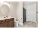 Bathroom features a white marble countertop, dark wood cabinets and gray wood-look flooring at 565 Stone Field Nw Run, Marietta, GA 30060