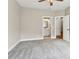 Large bedroom showcases ensuite bathroom with updated cabinetry and grey walls at 565 Stone Field Nw Run, Marietta, GA 30060