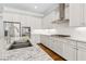 Close-up of the white kitchen with stainless steel appliances and granite countertops at 565 Stone Field Nw Run, Marietta, GA 30060