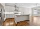 Modern kitchen featuring white cabinetry, stainless steel appliances, granite countertops and hardwood floors at 565 Stone Field Nw Run, Marietta, GA 30060