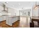 Bright open kitchen with an island, stainless steel appliances, and hardwood floors at 565 Stone Field Nw Run, Marietta, GA 30060