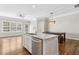 Modern kitchen showcasing a center island, stainless steel appliances, and hardwood floors at 565 Stone Field Nw Run, Marietta, GA 30060